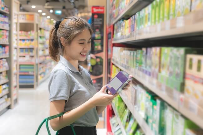 Woman shopping the authentic Asian aisle at the grocery store